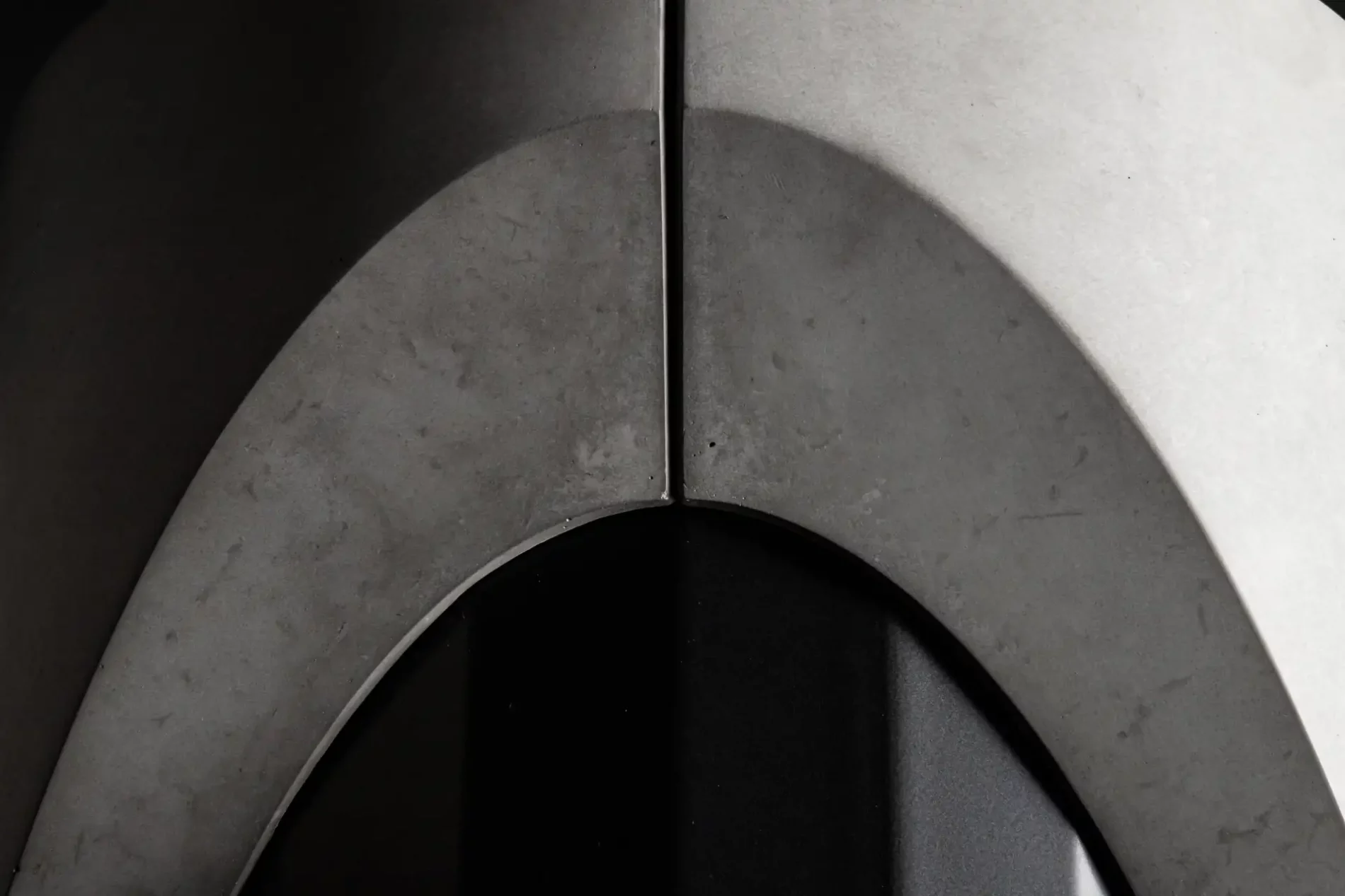 Brutalist detail of the concrete foot of the Sharp dining table by designer Bertrand Jayr