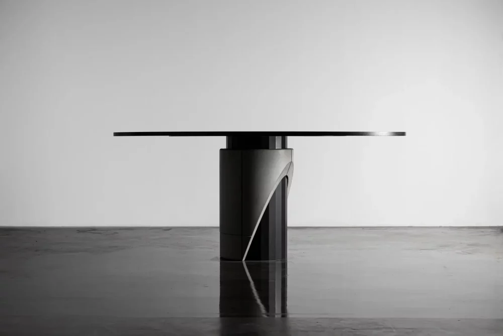 Majestic Dining table for 6 to 8 people black tinted wooden table top and metal and concrete foot for a modern and brutalist style