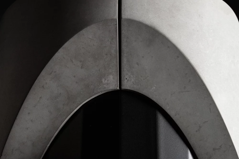 Brutalist detail of the concrete foot of the Sharp dining table by designer Bertrand Jayr