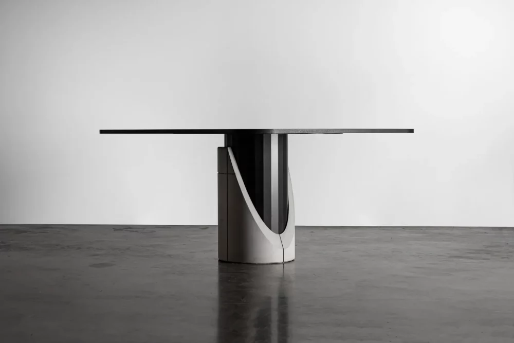 Dining table with brutalist design mixing concrete, black wood and metal by Lyon béton