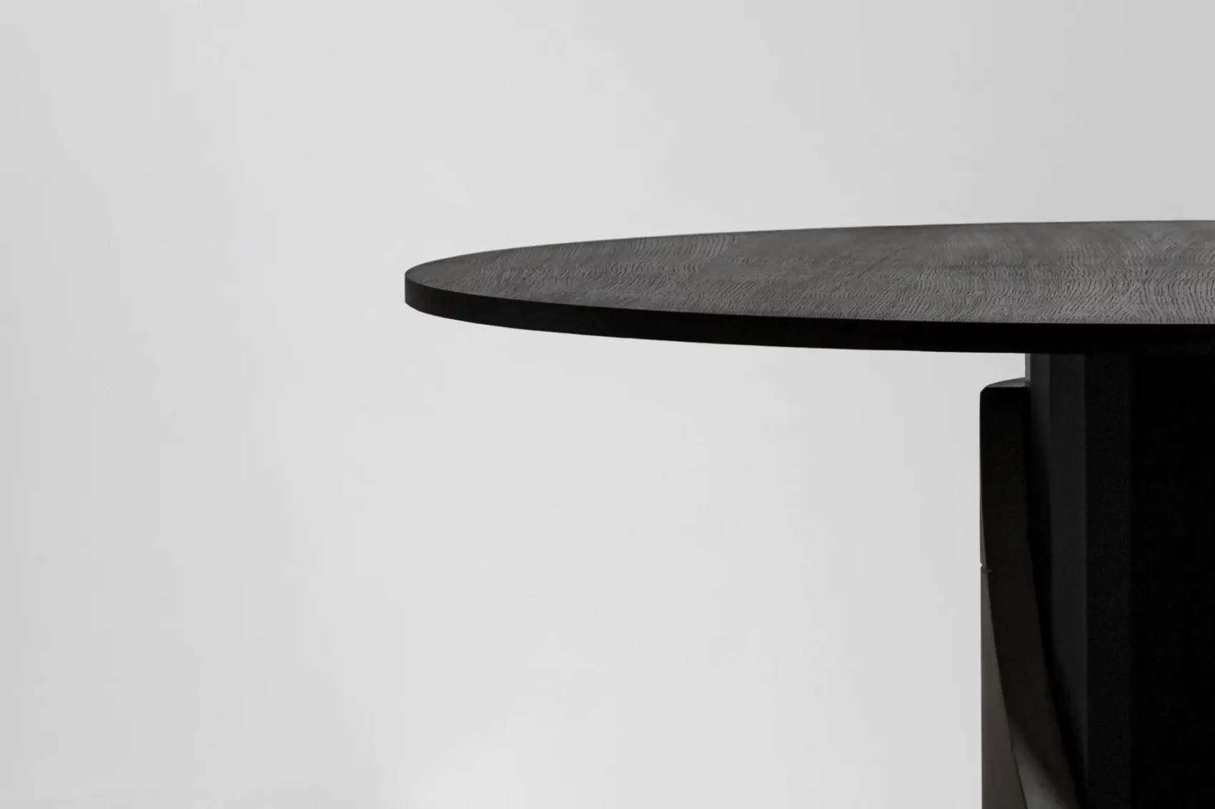 Detail of the wooden tinted matt black oak tabletop of the Sharp dining table by Bertrand Jayr