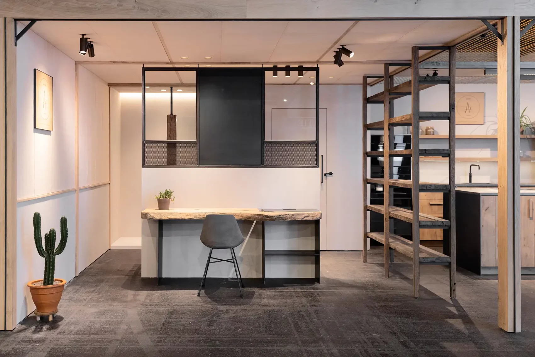 Hauteville concrete chair in a space with live edge wood desk and metal shelving — Lyon Béton