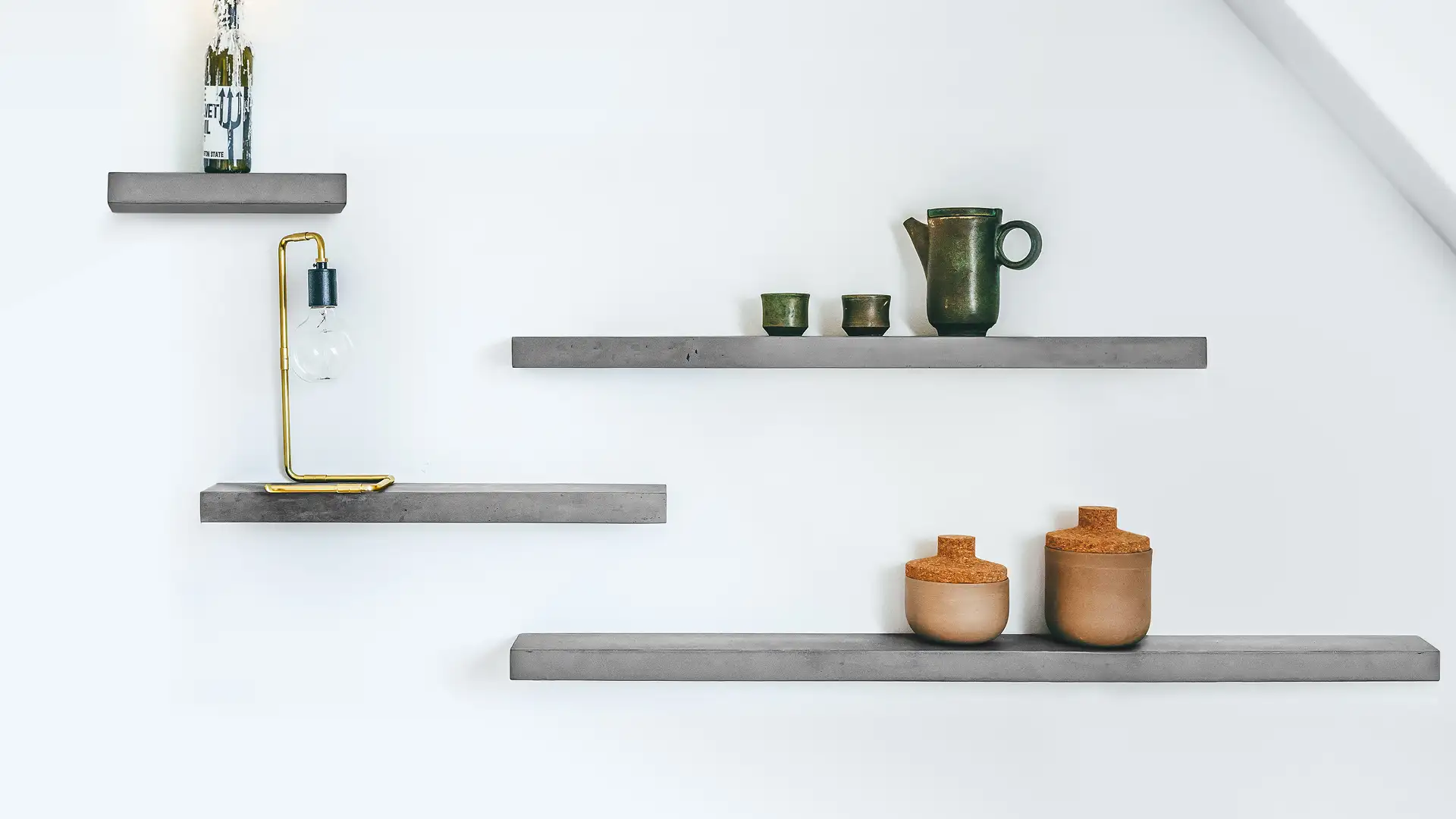 Staggered Sliced concrete wall shelves composition with teapot, vases and brass lamp — Lyon Béton