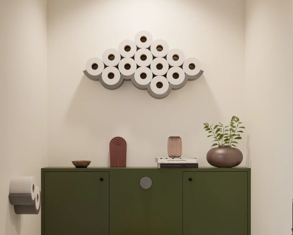 Large concrete Cloud toilet paper holder filled with rolls above a green cabinet, with a Cloud dispenser on the left.