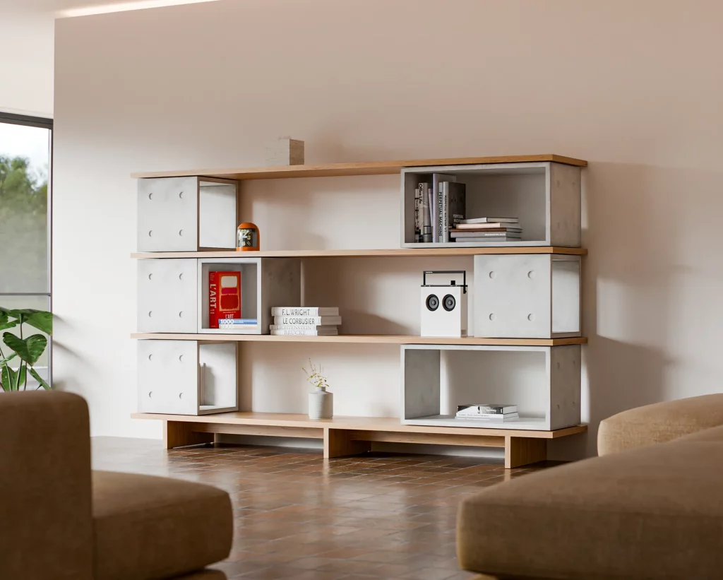 Bookcase made of concrete Dice modules and oak shelves, with books and a speaker.